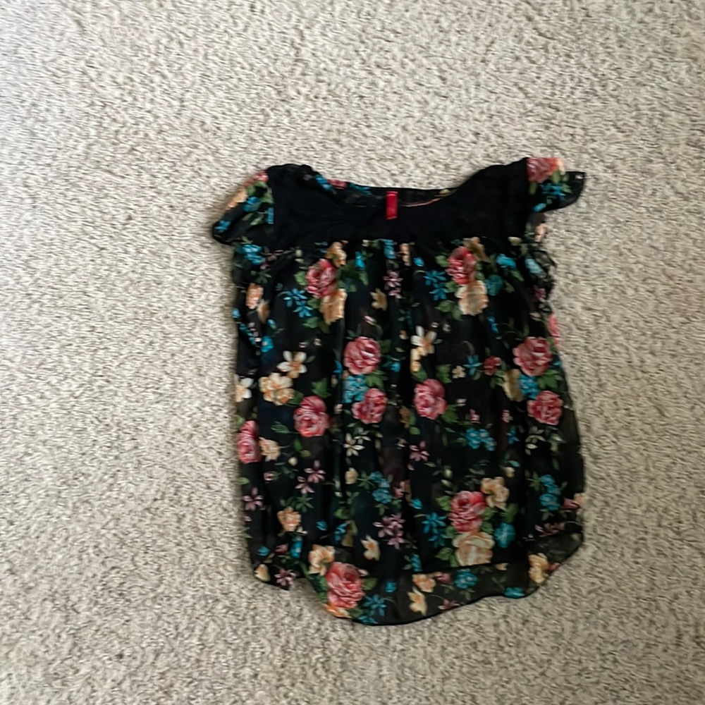 Women’s flutter sleeve baby doll top. Sheer black floral, lace yoke